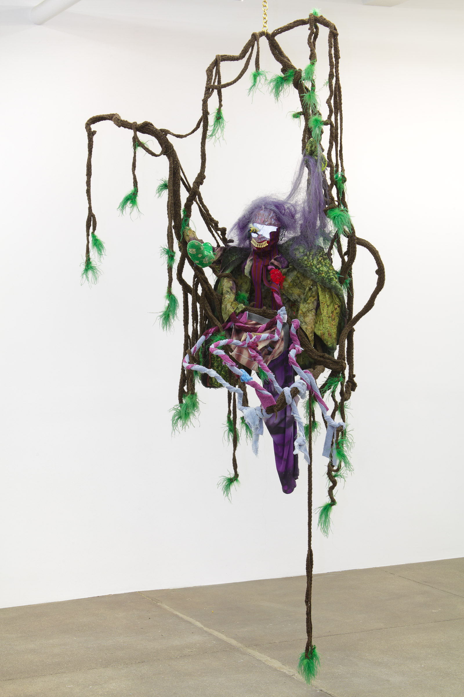 Look me in the eye (Felted wool, coat hanger, reflective material, vintage millinery tubing, vintage fabric, towel, feather, horse hair, hand-dyed under garments, aluminum tubing, brass chain, 2011-2013)